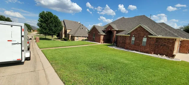 Freshly mowed corner lot with crisp edges in Saginaw TX