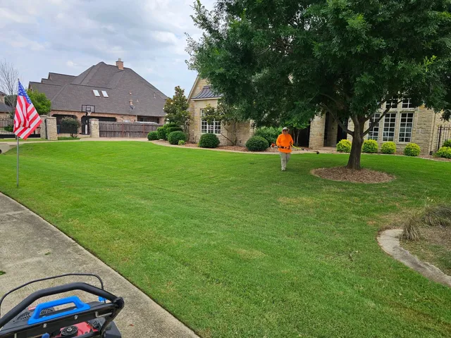 Two-story home front lawn mowed and edged in North Fort Worth
